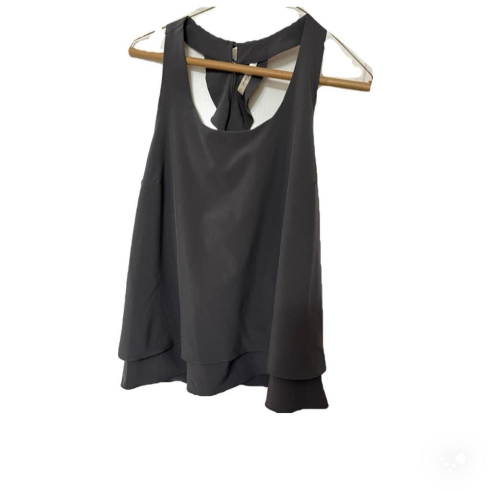 Boutique grey sleeveless racerback top with ruffle details